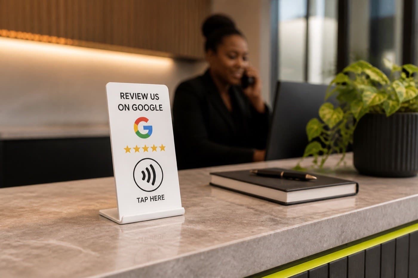Google Review NFC stand positioned on a professional reception desk
